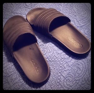 Solid black Adidas cloudfoam slides